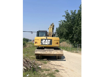 Ekskavator roda CATERPILLAR