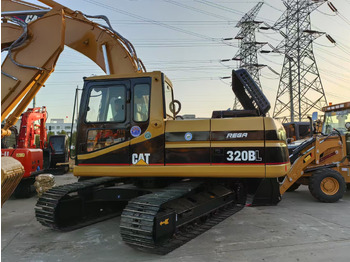 Ekskavator perayap CATERPILLAR