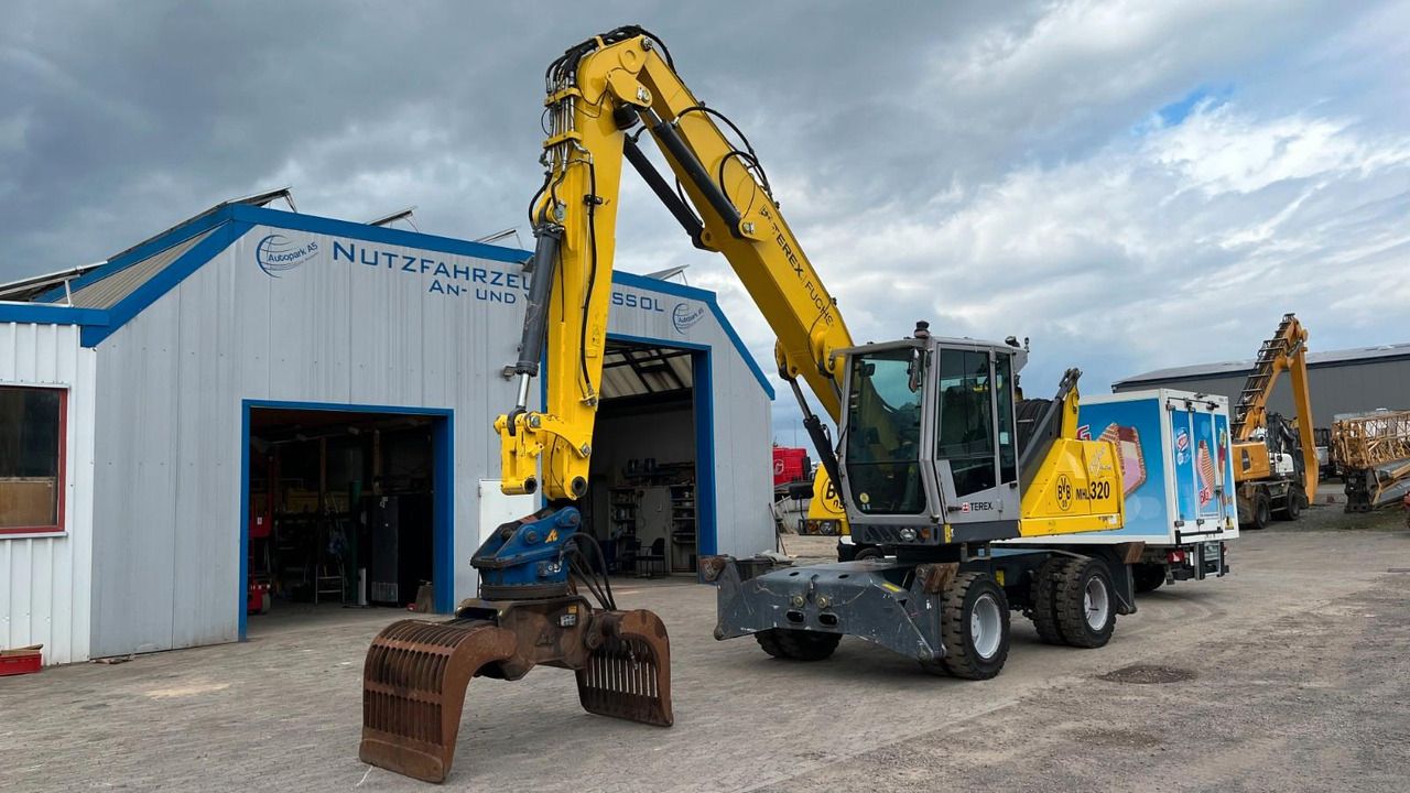 Fuchs TeRex MHL 320 D Umschlagbagger Greifer Pratzen - Mesin pengisi: gambar 3 Fuchs TeRex MHL 320 D Umschlagbagger Greifer Pratzen - Mesin pengisi: gambar 3