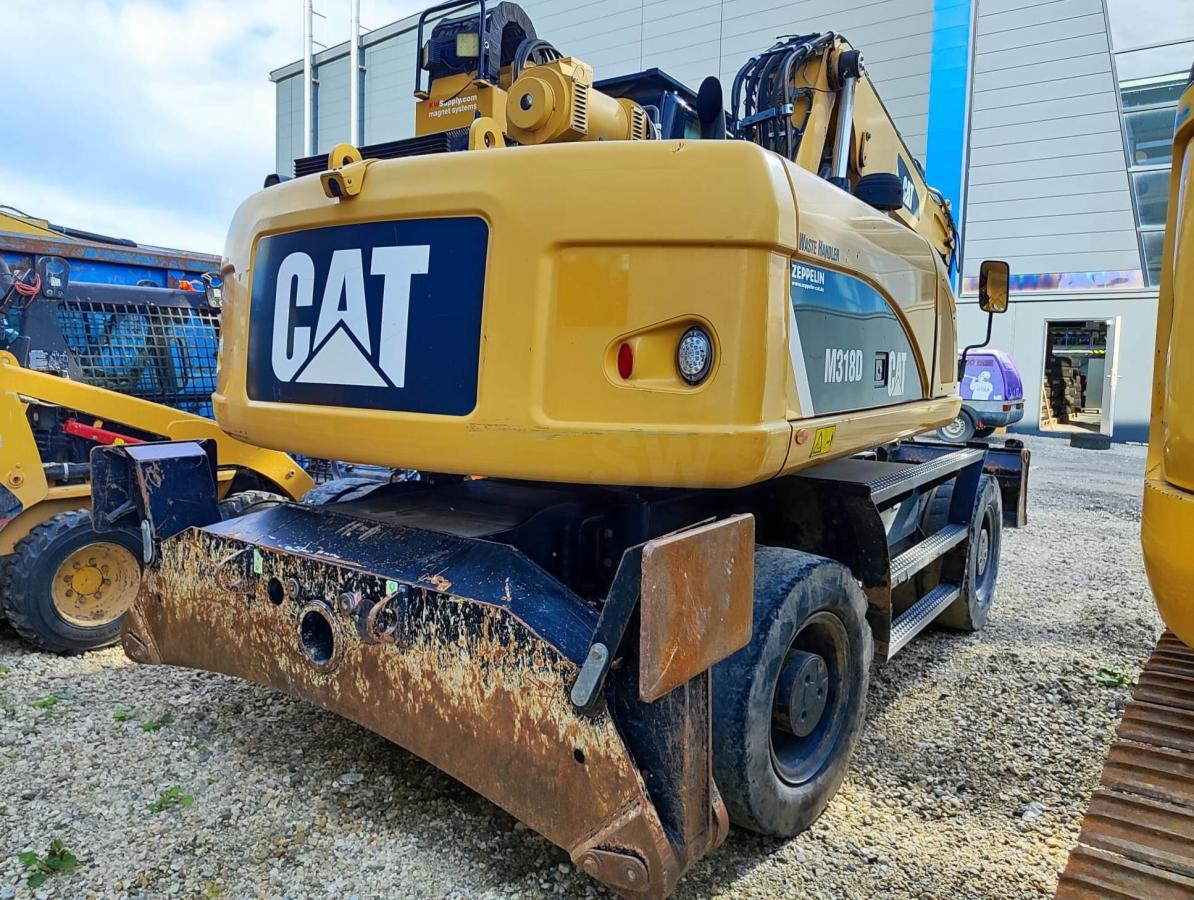 Caterpillar M318D MH - Ekskavator roda: gambar 4 Caterpillar M318D MH - Ekskavator roda: gambar 4