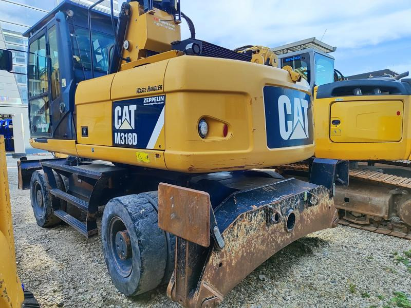 Caterpillar M318D MH - Ekskavator roda: gambar 1 Caterpillar M318D MH - Ekskavator roda: gambar 1