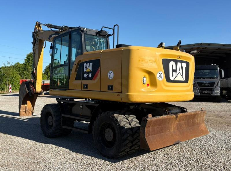 Caterpillar M318F - Ekskavator roda: gambar 1 Caterpillar M318F - Ekskavator roda: gambar 1