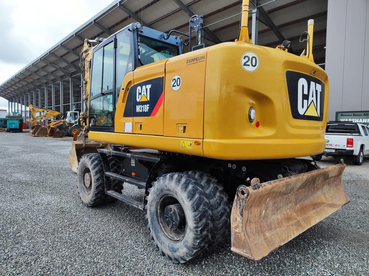 Caterpillar M318F - Ekskavator roda: gambar 1 Caterpillar M318F - Ekskavator roda: gambar 1