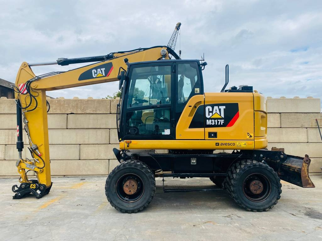 CAT m317f - Ekskavator roda: gambar 1 CAT m317f - Ekskavator roda: gambar 1