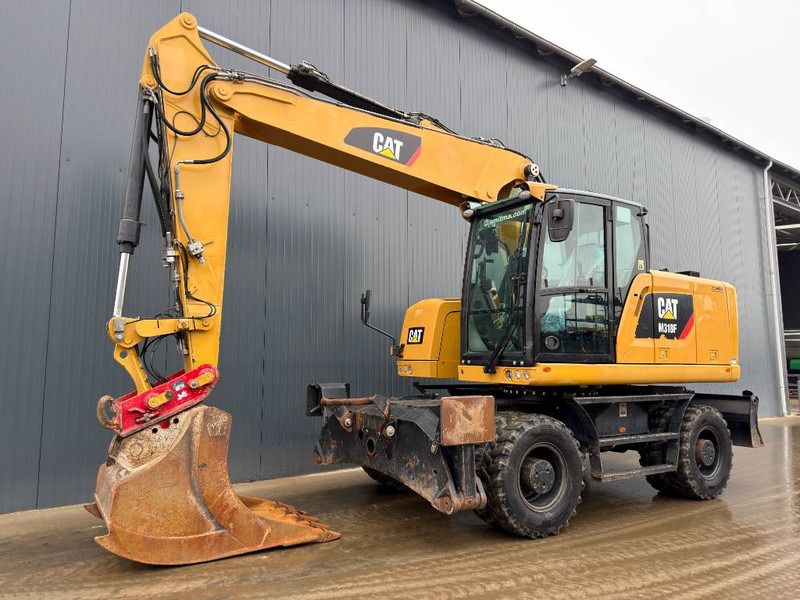Cat M318F - Ekskavator roda: gambar 1 Cat M318F - Ekskavator roda: gambar 1