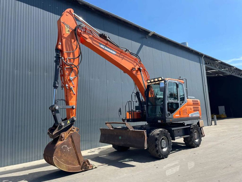 Doosan DX170W-5 - Ekskavator roda: gambar 1 Doosan DX170W-5 - Ekskavator roda: gambar 1