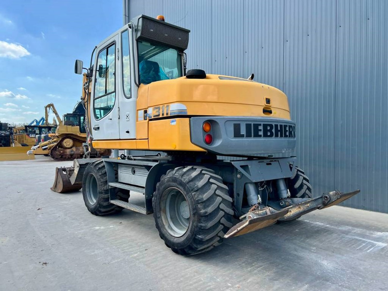 Liebherr A311 Litronic - Ekskavator roda: gambar 2 Liebherr A311 Litronic - Ekskavator roda: gambar 2
