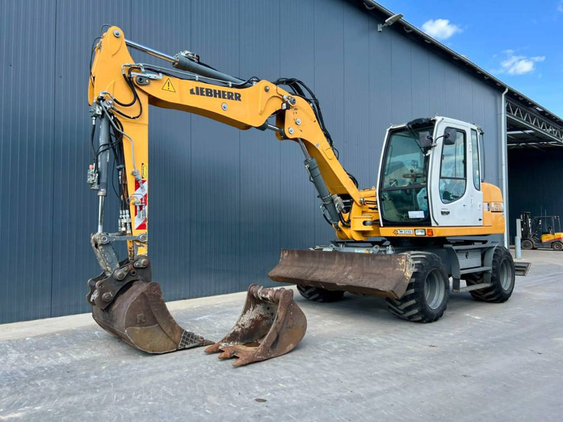 Liebherr A311 Litronic - Ekskavator roda: gambar 1 Liebherr A311 Litronic - Ekskavator roda: gambar 1