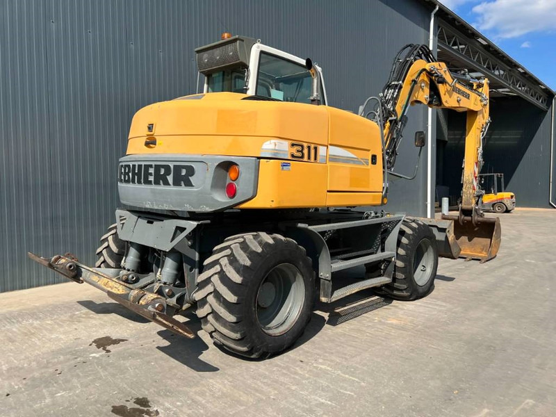 Liebherr A311 Litronic - Ekskavator roda: gambar 4 Liebherr A311 Litronic - Ekskavator roda: gambar 4