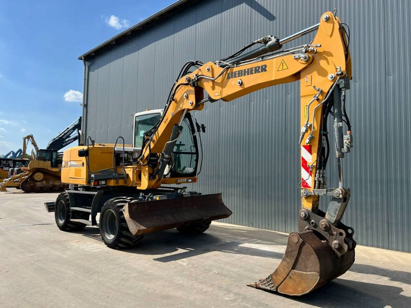 Liebherr A311 Litronic - Ekskavator roda: gambar 3 Liebherr A311 Litronic - Ekskavator roda: gambar 3