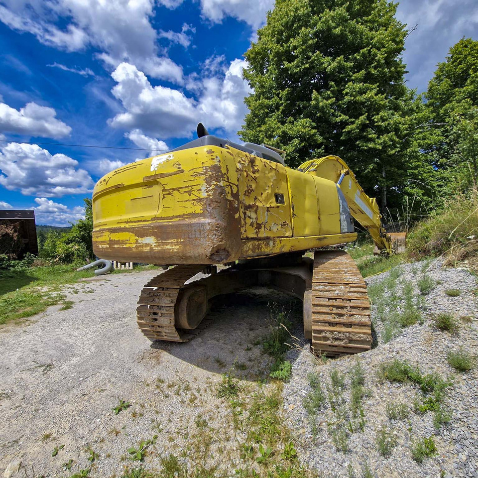 New Holland Kobelco E215 - Ekskavator perayap: gambar 5 New Holland Kobelco E215 - Ekskavator perayap: gambar 5