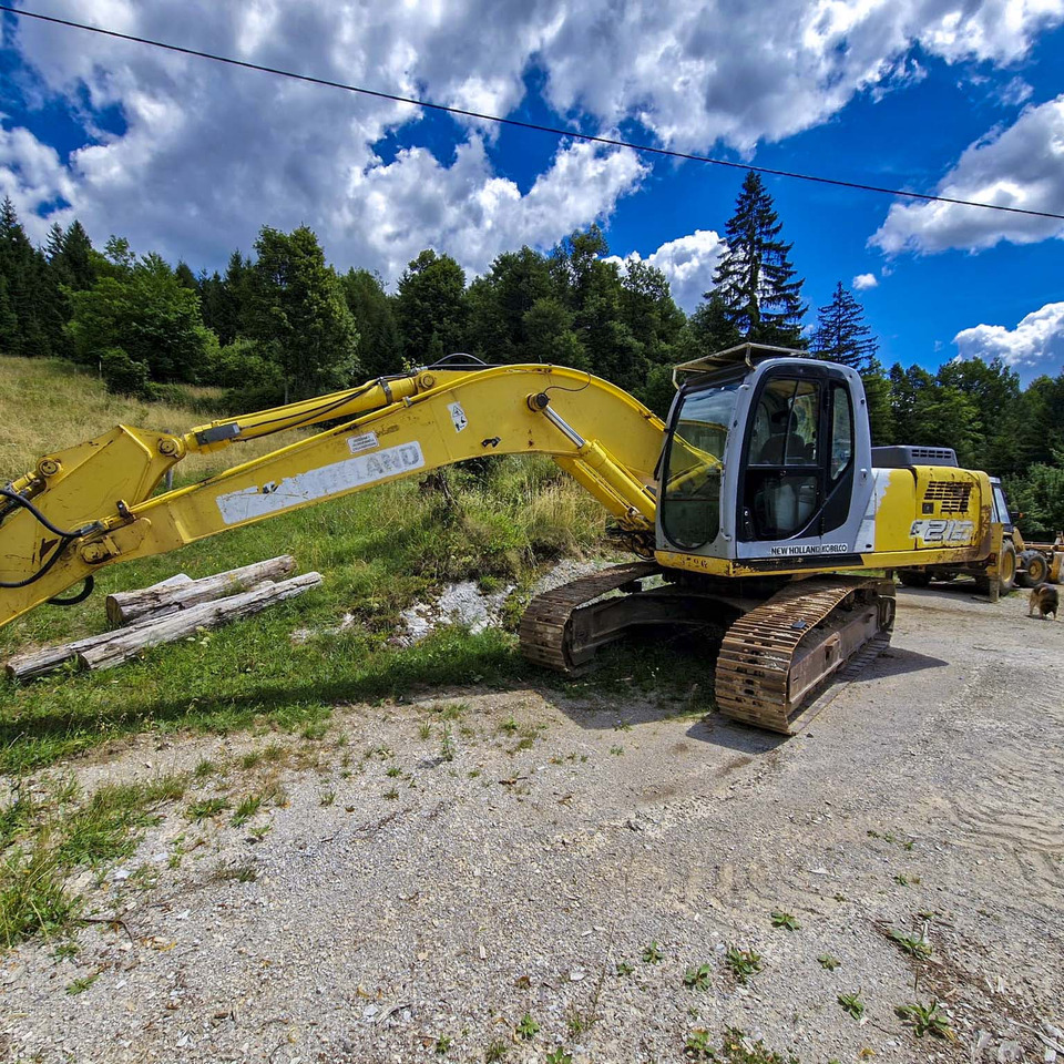 New Holland Kobelco E215 - Ekskavator perayap: gambar 2 New Holland Kobelco E215 - Ekskavator perayap: gambar 2