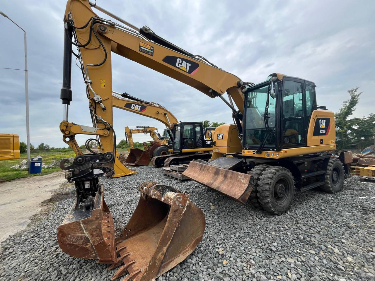 CAT M315F - Ekskavator roda: gambar 1 CAT M315F - Ekskavator roda: gambar 1
