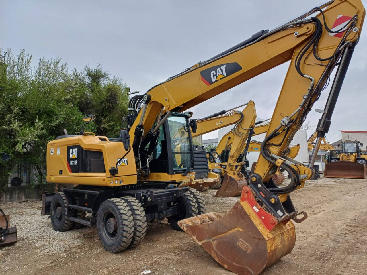 CAT M318F - Ekskavator roda: gambar 2 CAT M318F - Ekskavator roda: gambar 2