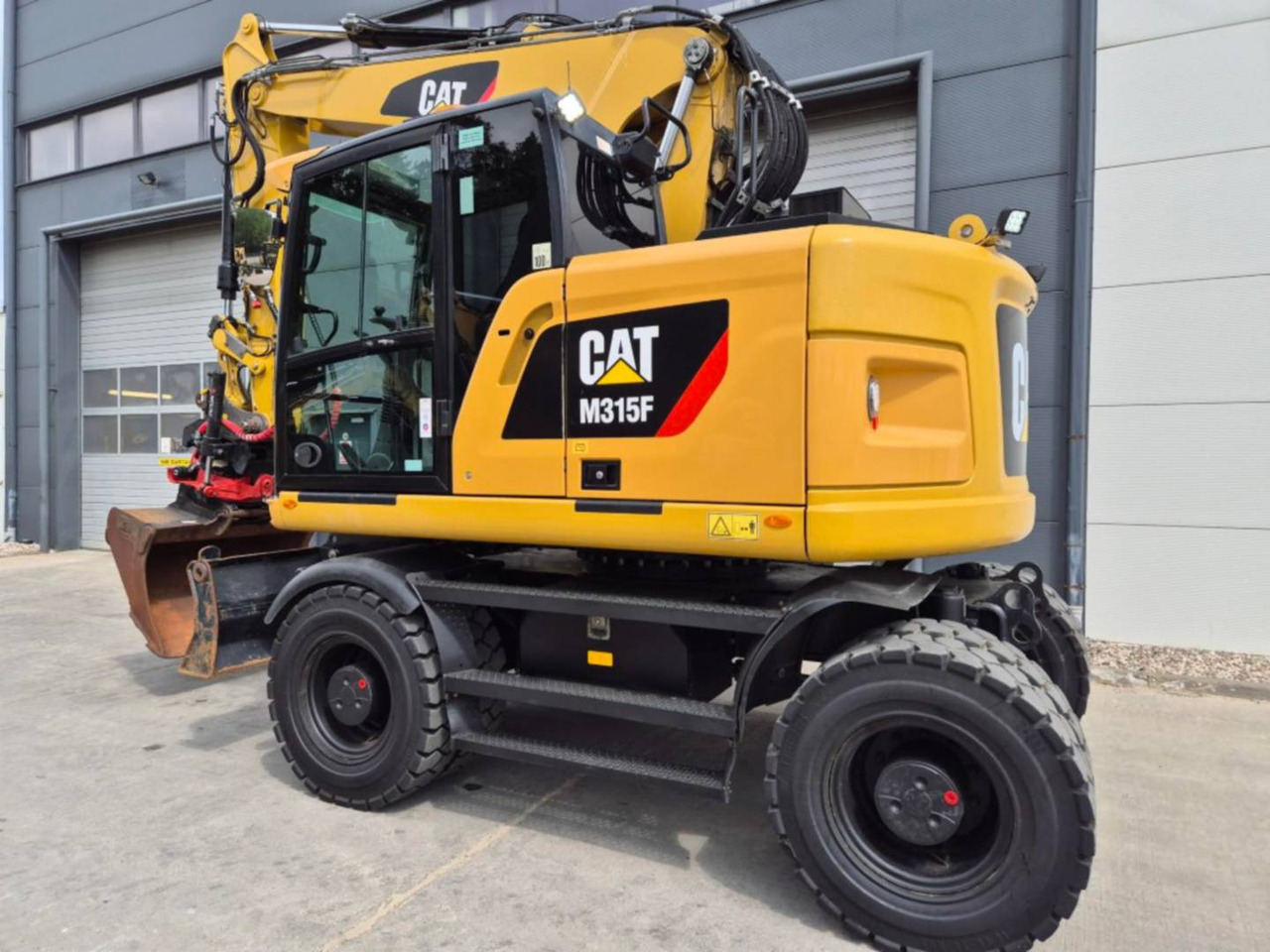 CAT M315F - Ekskavator roda: gambar 4 CAT M315F - Ekskavator roda: gambar 4