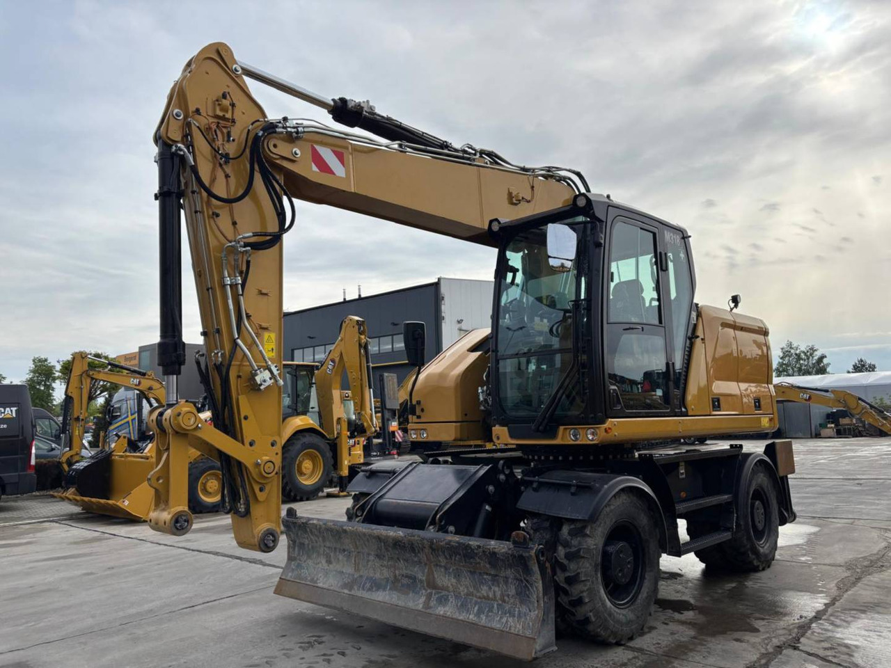 CAT M318 - Ekskavator roda: gambar 1 CAT M318 - Ekskavator roda: gambar 1