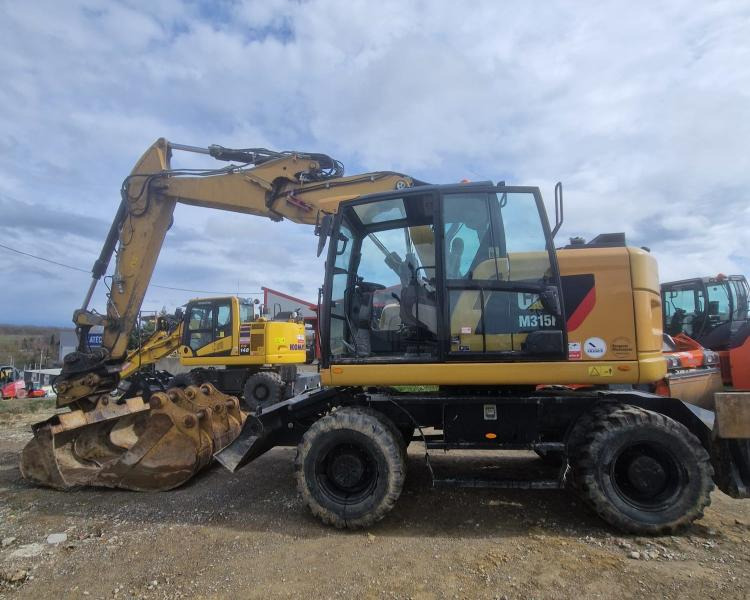 Caterpillar M315F F - Ekskavator roda: gambar 1 Caterpillar M315F F - Ekskavator roda: gambar 1