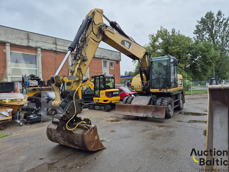 Caterpillar M 315 D - Ekskavator roda: gambar 1 Caterpillar M 315 D - Ekskavator roda: gambar 1
