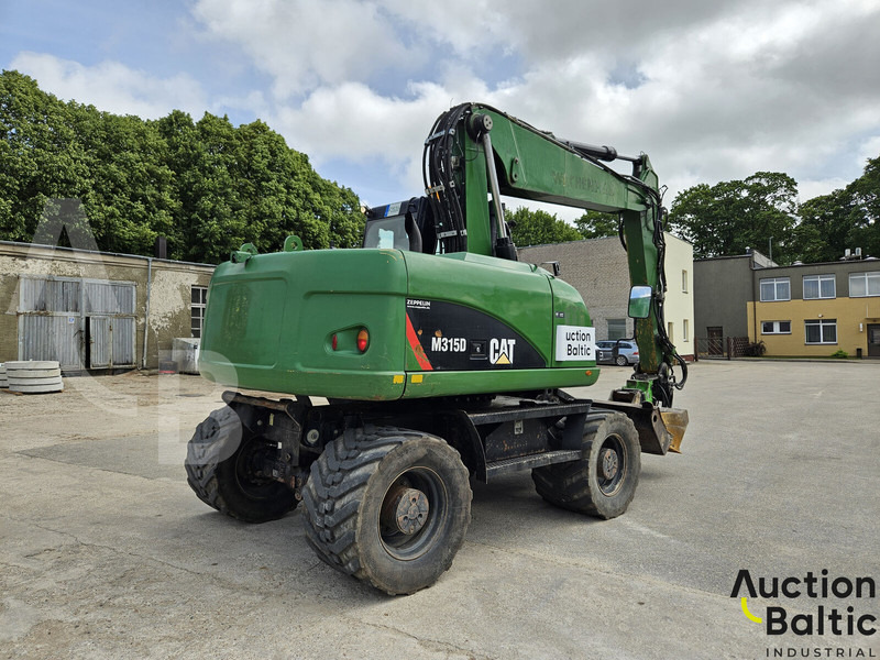 Caterpillar M315D - Ekskavator roda: gambar 3 Caterpillar M315D - Ekskavator roda: gambar 3