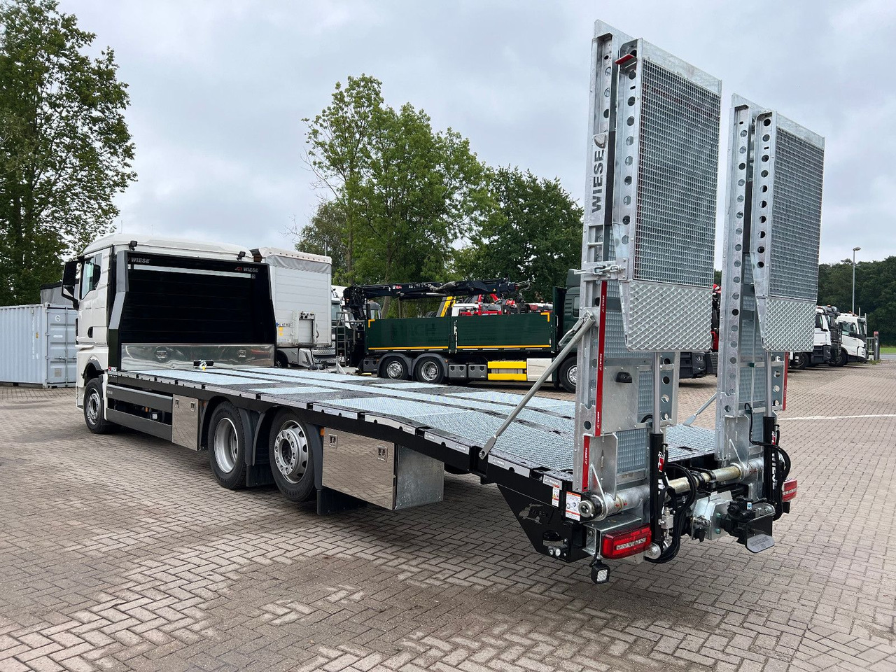 MAN Baumaschinen- Arbeitsbühnentransporter Rampen - Mobil derek: gambar 1 MAN Baumaschinen- Arbeitsbühnentransporter Rampen - Mobil derek: gambar 1