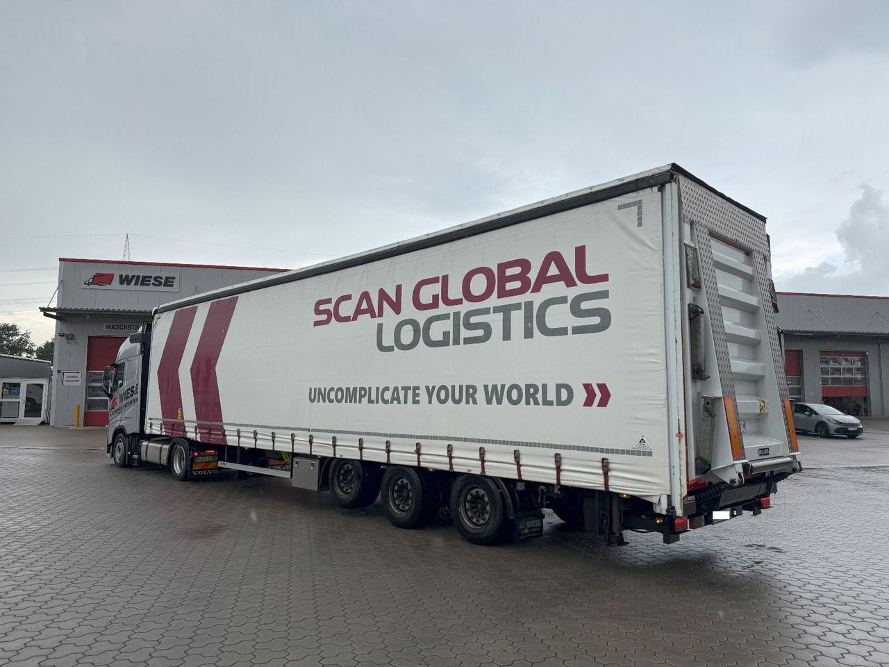 Wiese Mega Schiebeplane mit Dhollandia Rampe 9t - Semi-trailer dengan terpal samping: gambar 1 Wiese Mega Schiebeplane mit Dhollandia Rampe 9t - Semi-trailer dengan terpal samping: gambar 1