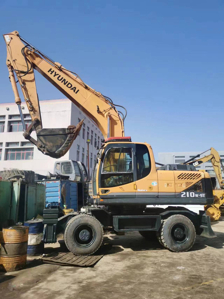 HYUNDAI 210W-9 - Ekskavator roda: gambar 1 HYUNDAI 210W-9 - Ekskavator roda: gambar 1