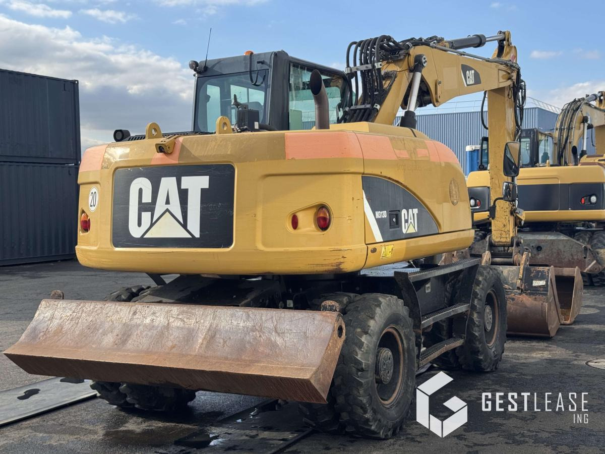 Caterpillar M313D - Ekskavator roda: gambar 3 Caterpillar M313D - Ekskavator roda: gambar 3