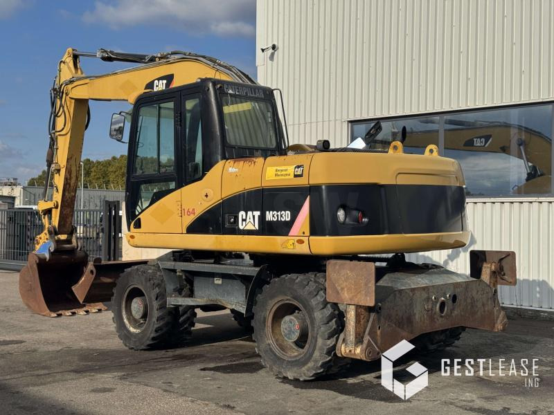 Caterpillar M313D - Ekskavator roda: gambar 2 Caterpillar M313D - Ekskavator roda: gambar 2