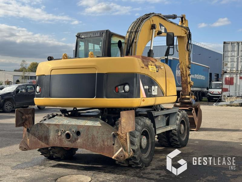 Caterpillar M313D - Ekskavator roda: gambar 3 Caterpillar M313D - Ekskavator roda: gambar 3