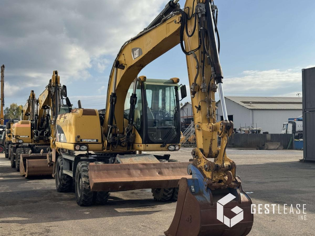Caterpillar M313D - Ekskavator roda: gambar 4 Caterpillar M313D - Ekskavator roda: gambar 4
