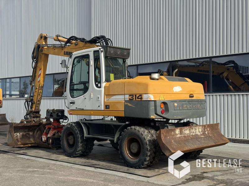 Liebherr A314 Litronic - Ekskavator roda: gambar 3 Liebherr A314 Litronic - Ekskavator roda: gambar 3