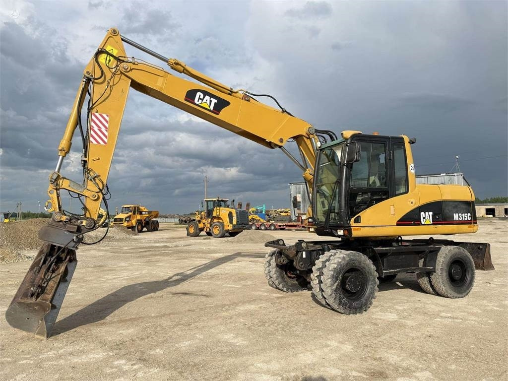 CAT M315C - Ekskavator roda: gambar 3 CAT M315C - Ekskavator roda: gambar 3