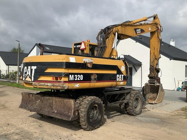 CAT M320 - Ekskavator roda: gambar 4 CAT M320 - Ekskavator roda: gambar 4