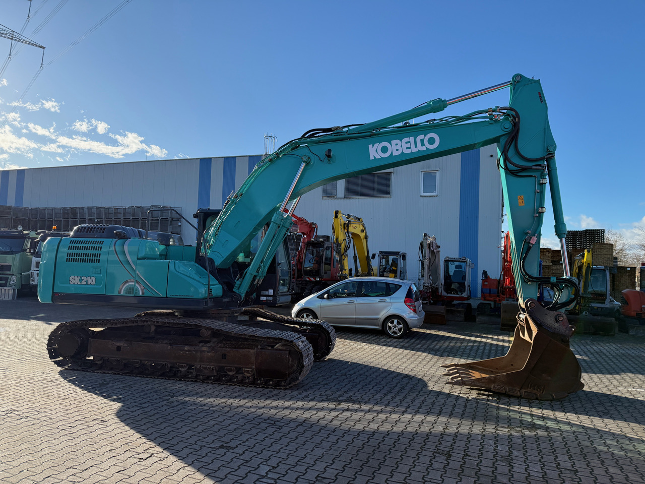 Kobelco SK210 NLC-10 Kettenbagger Oilquick Klima - Ekskavator perayap: gambar 3 Kobelco SK210 NLC-10 Kettenbagger Oilquick Klima - Ekskavator perayap: gambar 3