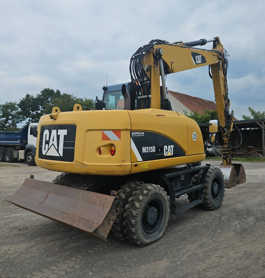 CAT M315D orig. 4.129h - Ekskavator roda: gambar 2 CAT M315D orig. 4.129h - Ekskavator roda: gambar 2