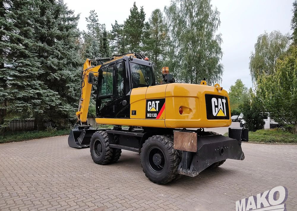 Caterpillar M313D - Ekskavator roda: gambar 2 Caterpillar M313D - Ekskavator roda: gambar 2
