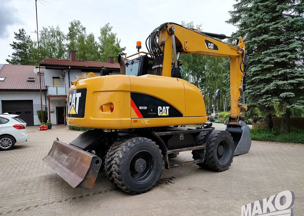 Caterpillar M313D - Ekskavator roda: gambar 4 Caterpillar M313D - Ekskavator roda: gambar 4