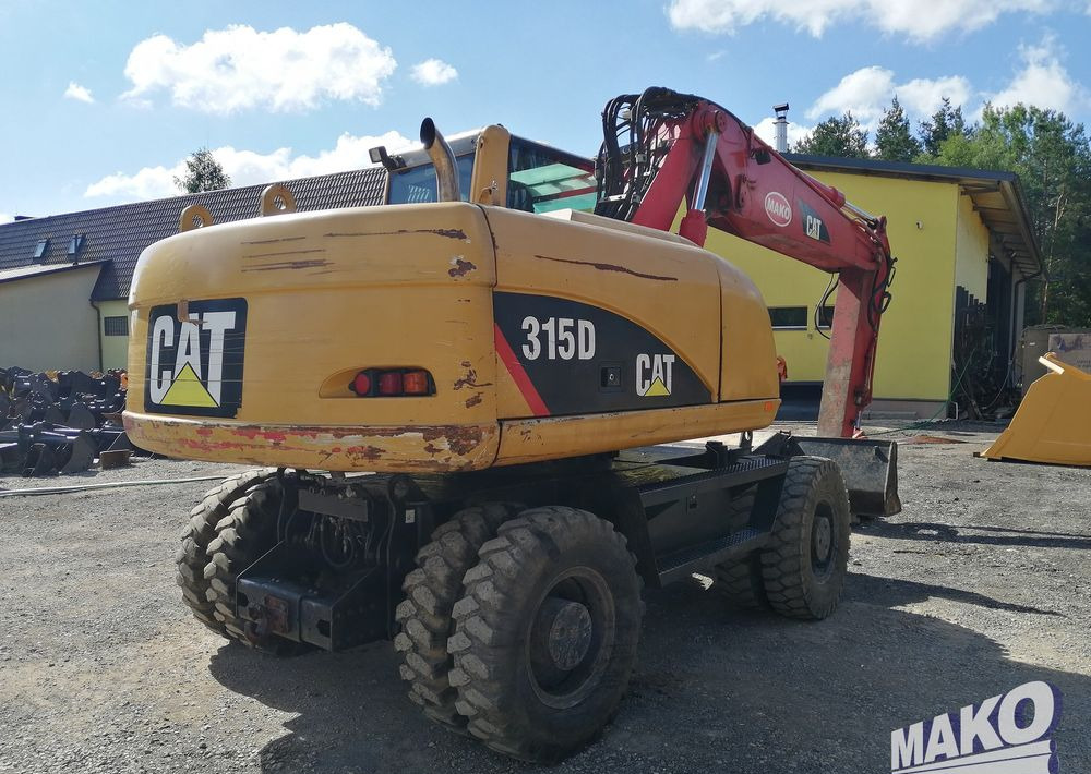 Caterpillar M315 C - Ekskavator roda: gambar 5 Caterpillar M315 C - Ekskavator roda: gambar 5