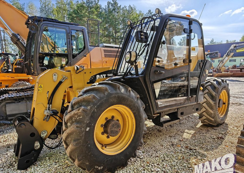 Caterpillar TH407 - Telehandler: gambar 1 Caterpillar TH407 - Telehandler: gambar 1