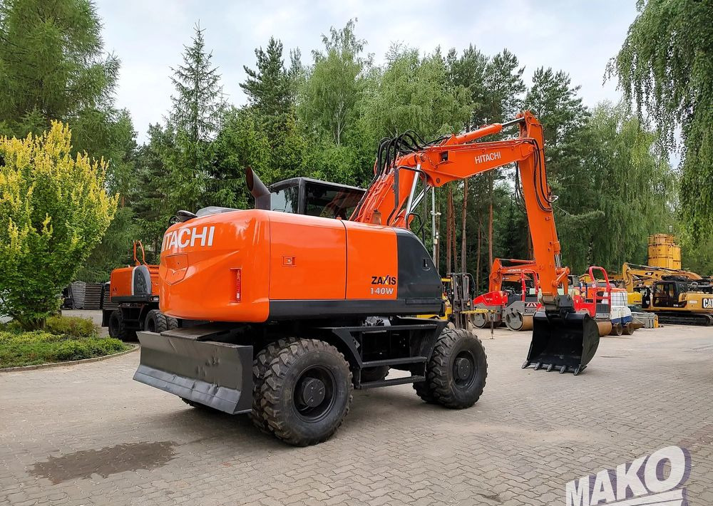 Hitachi ZX 140 - Ekskavator roda: gambar 4 Hitachi ZX 140 - Ekskavator roda: gambar 4