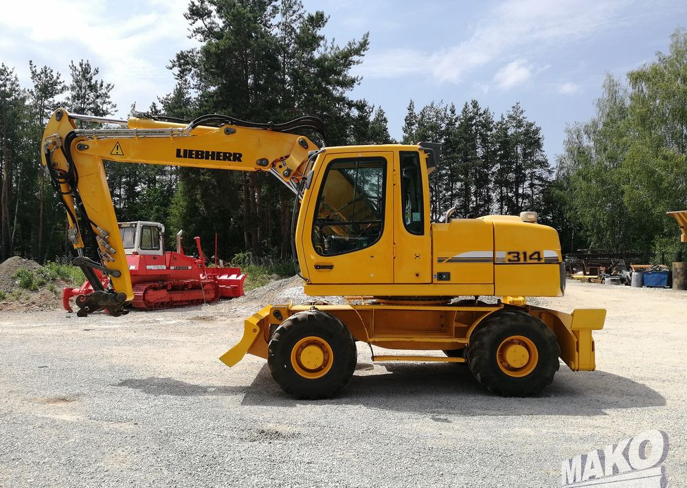 Liebherr A 314 Litronic - Ekskavator roda: gambar 2 Liebherr A 314 Litronic - Ekskavator roda: gambar 2