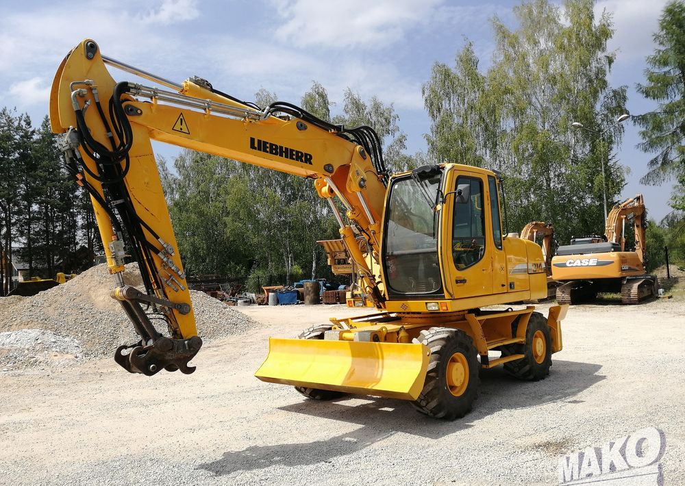 Liebherr A 314 Litronic - Ekskavator roda: gambar 1 Liebherr A 314 Litronic - Ekskavator roda: gambar 1