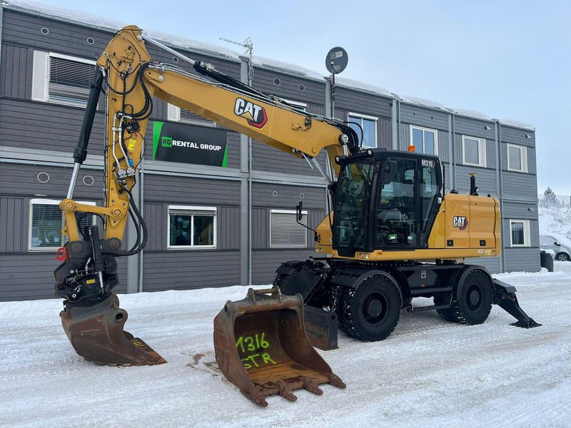 Caterpillar M316 - Ekskavator roda: gambar 1 Caterpillar M316 - Ekskavator roda: gambar 1