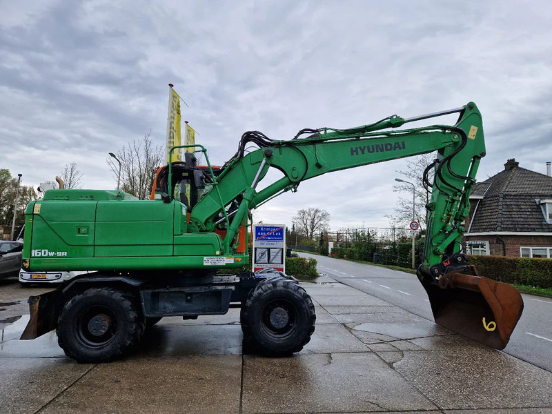 Hyundai Robex 160W-9A met 6-cilinder Cummins motor - Ekskavator roda: gambar 2 Hyundai Robex 160W-9A met 6-cilinder Cummins motor - Ekskavator roda: gambar 2