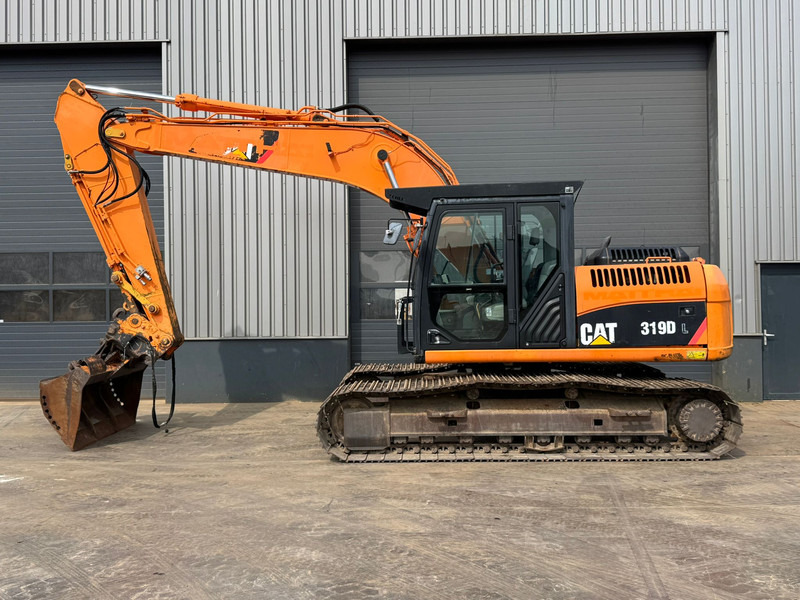 Caterpillar 319DL - Ekskavator perayap: gambar 1 Caterpillar 319DL - Ekskavator perayap: gambar 1