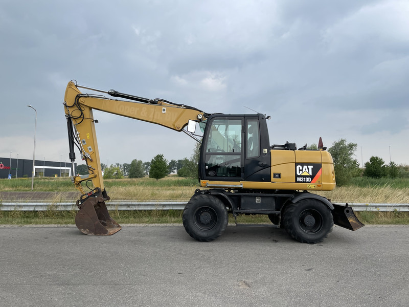 Caterpillar M313D - CE - Ekskavator roda: gambar 1 Caterpillar M313D - CE - Ekskavator roda: gambar 1