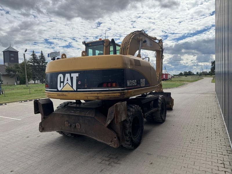 Caterpillar M 315 C - Ekskavator roda: gambar 3 Caterpillar M 315 C - Ekskavator roda: gambar 3