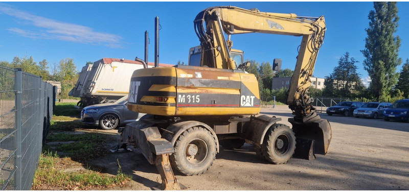 Caterpillar M 315 Rototilt - Ekskavator roda: gambar 2 Caterpillar M 315 Rototilt - Ekskavator roda: gambar 2