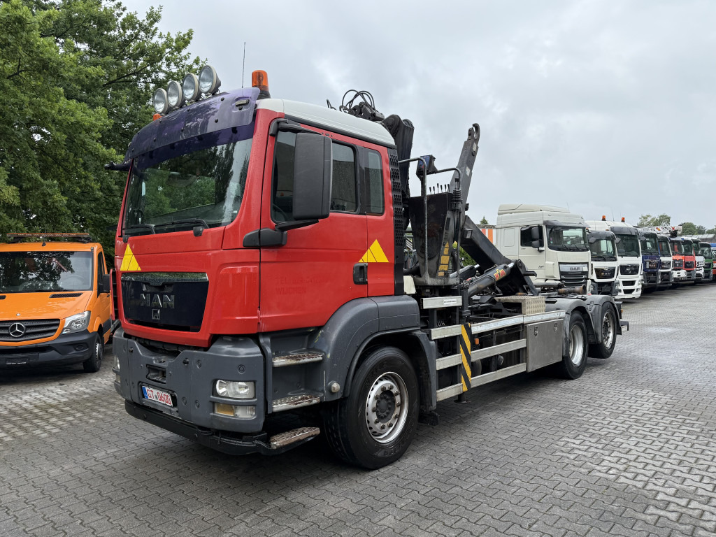 MAN TGS 26.360 6X2 Haken mit Kran HMF 1643Z - Hook lift, Truk derek: gambar 1 MAN TGS 26.360 6X2 Haken mit Kran HMF 1643Z - Hook lift, Truk derek: gambar 1