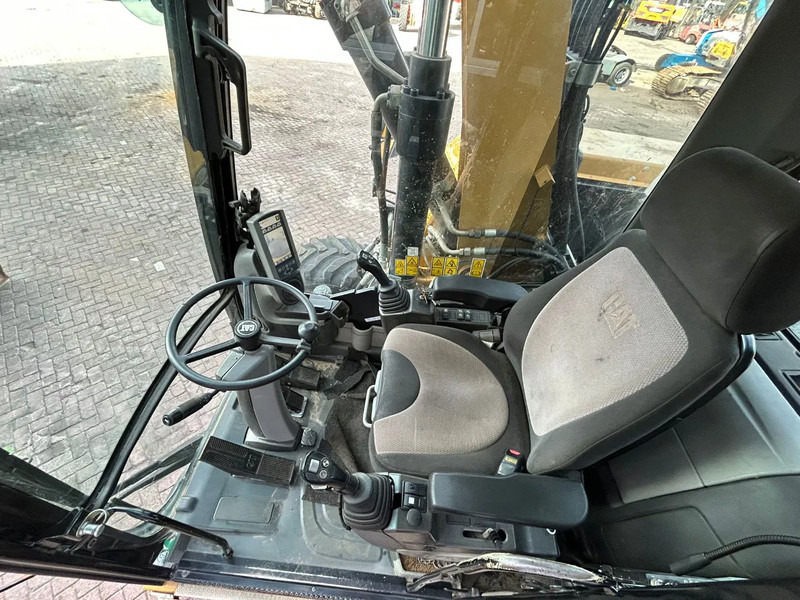 Ekskavator roda Caterpillar M313D: gambar 7